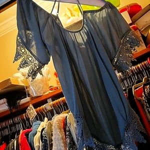 Willis has large sage green shirt with crochet straps and cold shoulder